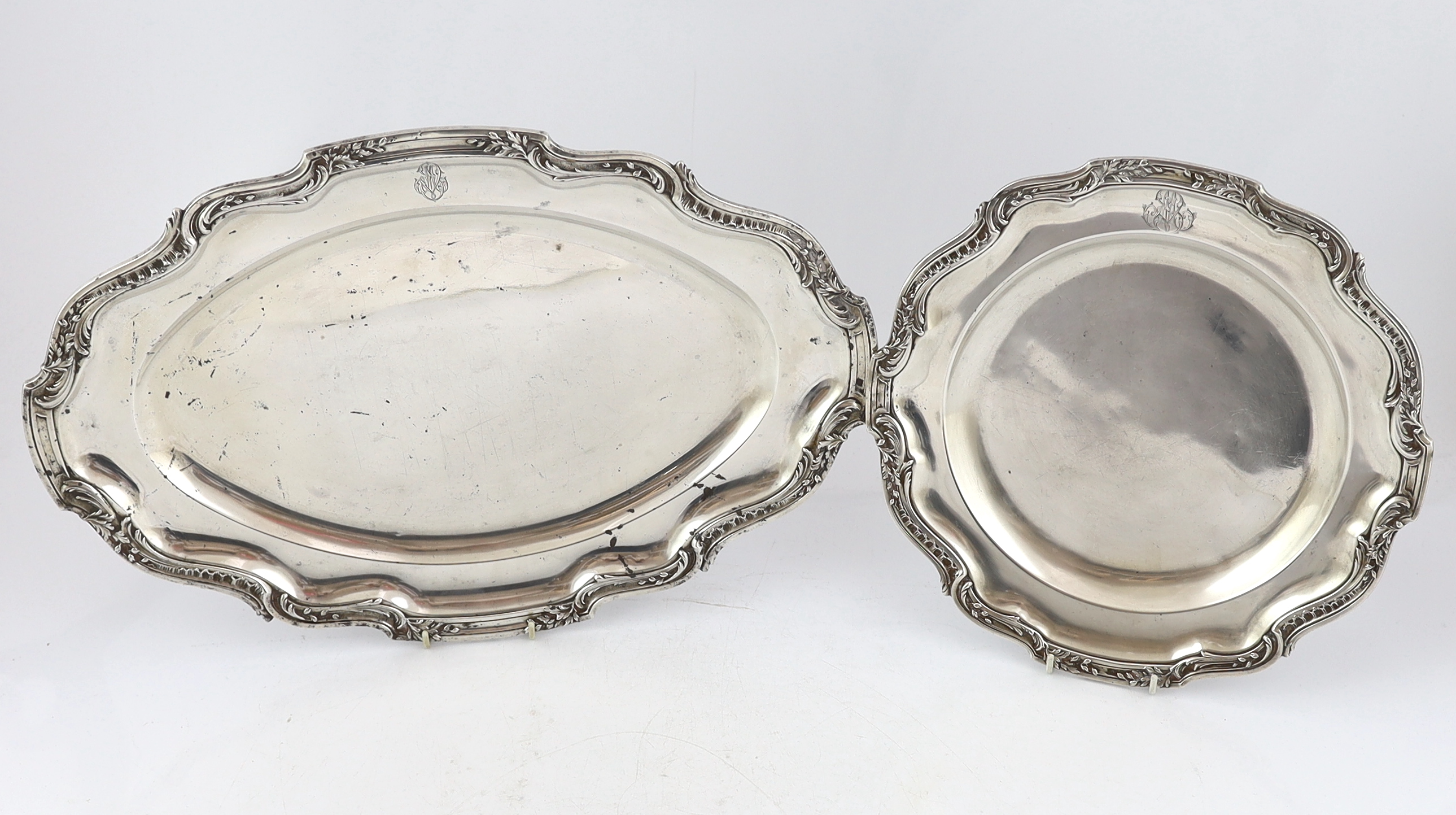 A late 19th century French 950 standard silver tureen and cover, a sauceboat on fixed stand and two serving dishes, by V. Boivin, Paris